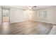 Bright living room with hardwood floors and access to other rooms at 7270 Oswego Trl, Riverdale, GA 30296