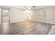 Bright living room featuring hardwood floors and an open floor plan at 7270 Oswego Trl, Riverdale, GA 30296