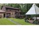 Home's backyard with a gazebo and patio at 4567 Town Crier Sw Rd, Lilburn, GA 30047