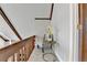 Bright hallway area with unique wooden finishes, gray carpet, and an elegant seating arrangement at 6460 Pine Ridge Cir, Cumming, GA 30041