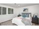 Serene bedroom featuring a queen-size bed, wood-look floors, and ample natural light at 2371 Wingfoot Pl, Decatur, GA 30035