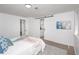 Bright bedroom with sliding barn door to en-suite bathroom, and wood-look floors at 2371 Wingfoot Pl, Decatur, GA 30035