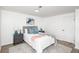 Cozy bedroom with a queen bed, wood-look floors, and en-suite bathroom access at 2371 Wingfoot Pl, Decatur, GA 30035