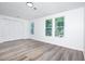 Spacious bedroom with large windows, wood-look floors, and ample closet space at 2371 Wingfoot Pl, Decatur, GA 30035