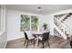 Bright dining area with four chairs and modern art at 2371 Wingfoot Pl, Decatur, GA 30035