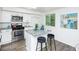 Modern kitchen with island, stainless steel appliances, and granite countertops at 2371 Wingfoot Pl, Decatur, GA 30035