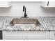 Modern kitchen sink with stainless steel basin and granite countertop at 2371 Wingfoot Pl, Decatur, GA 30035