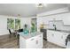 Updated kitchen with island, stainless steel appliances, and granite countertops at 2371 Wingfoot Pl, Decatur, GA 30035