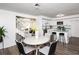 Open concept kitchen and dining area with modern finishes and island at 2371 Wingfoot Pl, Decatur, GA 30035