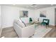Modern living room with a comfy sofa, accent chairs, and a glass coffee table at 2371 Wingfoot Pl, Decatur, GA 30035