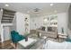 Spacious living room with a neutral color palette, hardwood floors, and large windows at 2371 Wingfoot Pl, Decatur, GA 30035