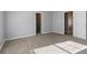 A bright and spacious bedroom with two entryways and plush neutral carpeting at 4811 Westgate Blvd, Atlanta, GA 30349