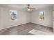 Bright bedroom with hardwood floors and ceiling fan at 871 Terrace Trce, Lawrenceville, GA 30044