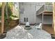 Relaxing backyard patio with fire pit and seating area at 135 River Point Ct, Alpharetta, GA 30022