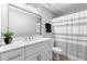 Basement bathroom with a white vanity and shower/tub at 135 River Point Ct, Alpharetta, GA 30022