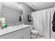 Clean basement bathroom with a white vanity and shower at 135 River Point Ct, Alpharetta, GA 30022