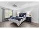 Cozy basement bedroom with a queen-size bed and window at 135 River Point Ct, Alpharetta, GA 30022