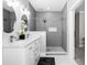 Elegant bathroom featuring double sinks and a large shower at 135 River Point Ct, Alpharetta, GA 30022