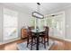 Bright dining area with hardwood floors and access to kitchen at 135 River Point Ct, Alpharetta, GA 30022