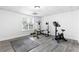 Basement home gym with exercise bike and weight bench at 135 River Point Ct, Alpharetta, GA 30022