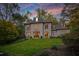 Exterior of a beautiful home with manicured lawn at 302 Rolling Rock Se Rd, Marietta, GA 30067