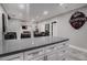 Modern kitchen island with gray countertop and white cabinets at 302 Rolling Rock Se Rd, Marietta, GA 30067