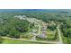 Aerial view of a neighborhood with manicured lawns in a park-like setting at 125 Registry Ln, Canton, GA 30115