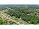 Lovely aerial of home near lush greenway, showcasing large, manicured lawns at 125 Registry Ln, Canton, GA 30115