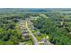 Aerial view of homes on large lots nestled within mature hardwood trees at 125 Registry Ln, Canton, GA 30115