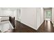 Hallway with hardwood floors, offering seamless transition between living spaces at 125 Registry Ln, Canton, GA 30115