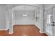 Dining room area showcasing hardwood floors, wainscotting, and modern light fixture at 593 Woodland Park Ter, Lawrenceville, GA 30043