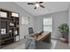 Cozy home office featuring a modern desk, bookshelf, and natural light at 593 Woodland Park Ter, Lawrenceville, GA 30043