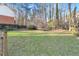 Expansive backyard with large lawn and trees providing privacy at 695 Arboreal Ct, Alpharetta, GA 30022