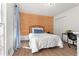 Cozy bedroom with wood-paneled accent wall and built-in workspace at 695 Arboreal Ct, Alpharetta, GA 30022