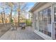 Wooden deck with seating area, overlooking wooded backyard at 695 Arboreal Ct, Alpharetta, GA 30022