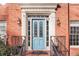 Charming blue front door with glass accents and brick facade at 695 Arboreal Ct, Alpharetta, GA 30022