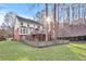 Exterior view of two-story house with large deck and fenced yard at 695 Arboreal Ct, Alpharetta, GA 30022