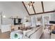 Living room with hardwood floors, vaulted ceiling and exposed beams at 695 Arboreal Ct, Alpharetta, GA 30022