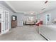 Main bedroom with sitting area and French doors leading to the bathroom at 695 Arboreal Ct, Alpharetta, GA 30022