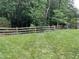 Wooden fence bordering a lush green lawn at 310 Medridge Dr, Johns Creek, GA 30022