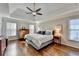 Spacious main bedroom with hardwood floors and large windows at 310 Medridge Dr, Johns Creek, GA 30022