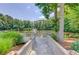 Peaceful pond with wooden deck and fountain, perfect for relaxing at 310 Medridge Dr, Johns Creek, GA 30022