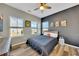 Secondary bedroom with accent wall and wood floor at 345 Commons Ave, Woodstock, GA 30188