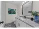 Updated bathroom featuring a stylish granite vanity and patterned floor at 4701 Flat Shoals Rd # 56E, Union City, GA 30291