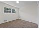 Well-lit bedroom featuring neutral walls and carpeted floor at 4701 Flat Shoals Rd # 56E, Union City, GA 30291