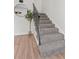 Modern staircase with simple metal railing and carpet at 4701 Flat Shoals Rd # 56E, Union City, GA 30291