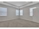 Bedroom with neutral walls, carpet, and multiple windows at 3069 Shirecrest Ln, Dacula, GA 30019