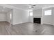 Living room with fireplace, gray flooring, and access to the kitchen at 3069 Shirecrest Lane, Dacula, GA 30019