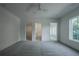 Bright bedroom with gray carpet, ceiling fan and ensuite bath at 5271 Lake Forrest Dr, Atlanta, GA 30342