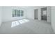 Bright bedroom with gray carpet and large window at 5271 Lake Forrest Dr, Atlanta, GA 30342